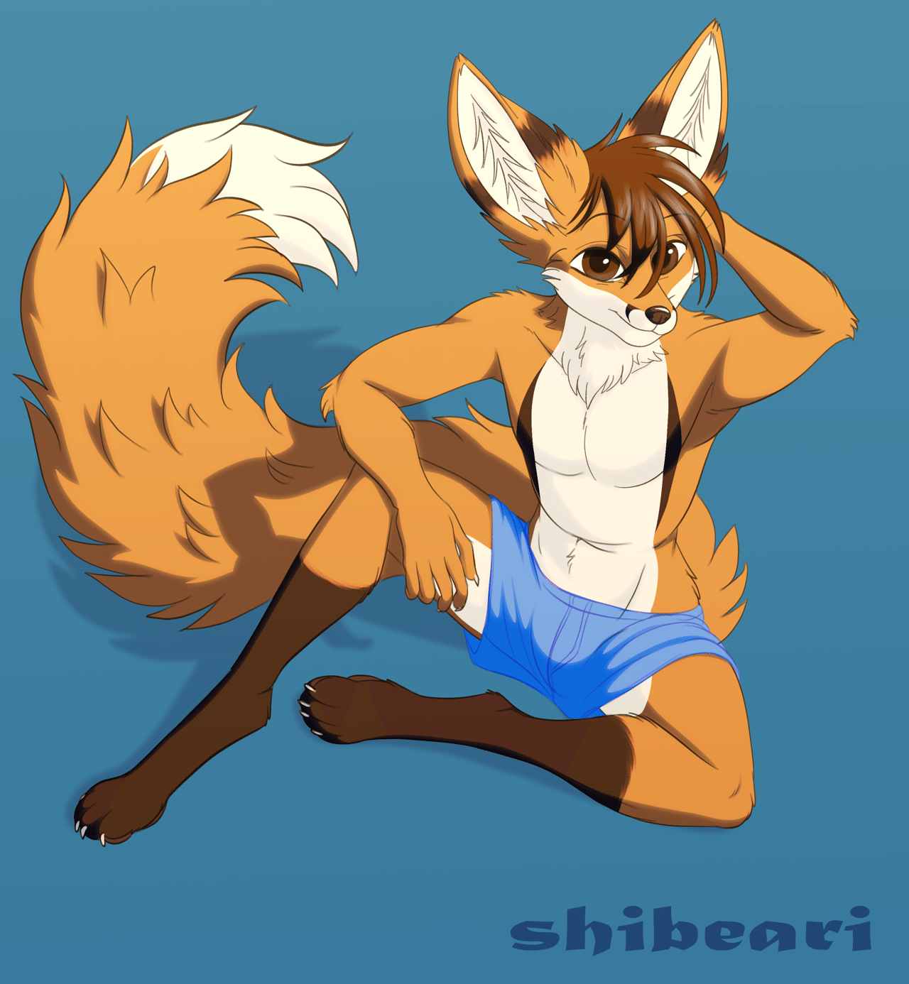 Kobaj sitting down sheepishly rubbing the back of his head.