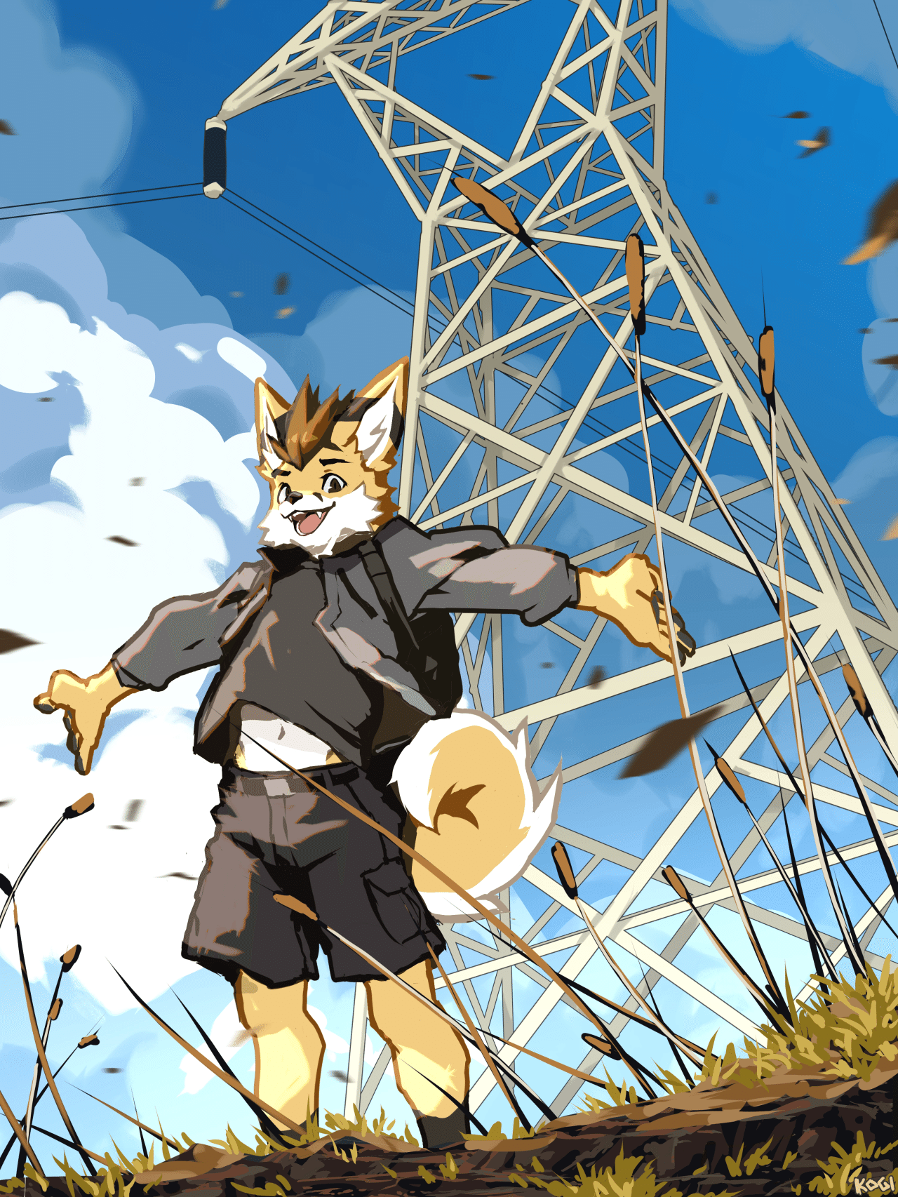 Kobaj having just hiked up a small hill is standing proud with his arms out wide and wind whips around him.